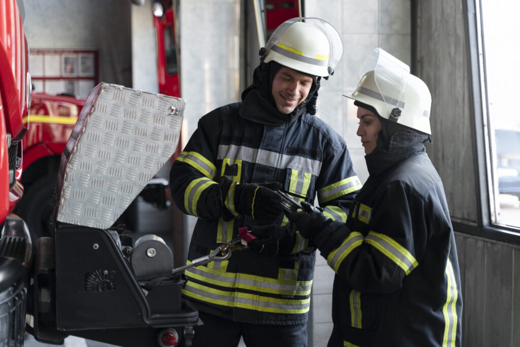 male-female-firefighters-working-together-suits-helmets